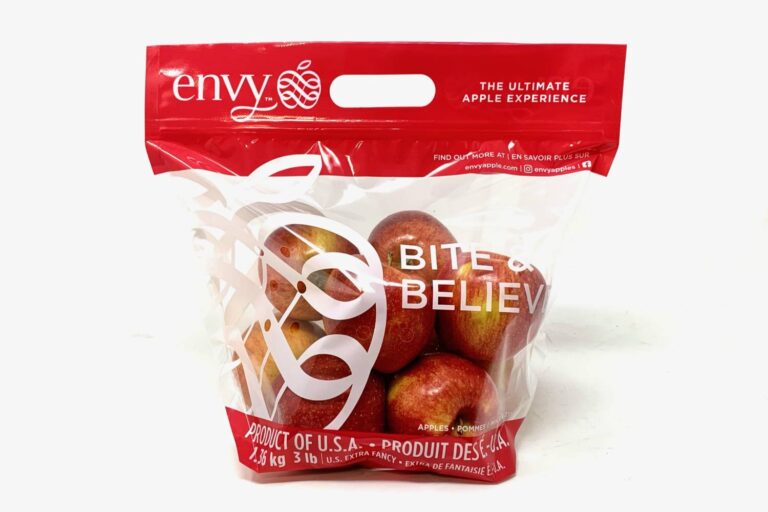Branded plastic bag holding a bunch of red apples of the Envy variety.