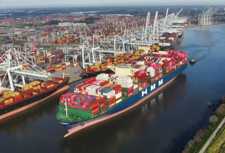 Aerial photo of a cargo ship filled with shipping containers in the port of Savannah, Georgia