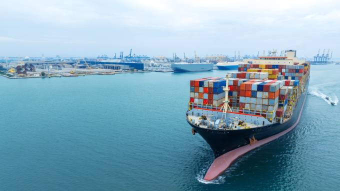 Shipping liner at a port filled with containers-a sign of the shipping industry's growing capacity in recent years.