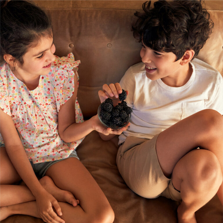 kids sharing berries