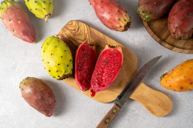 prickly pears cut on wooden board