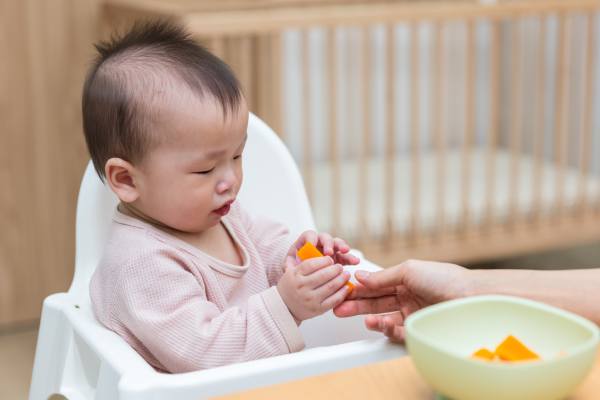 baby eating baby carrots fruit-type vegetable